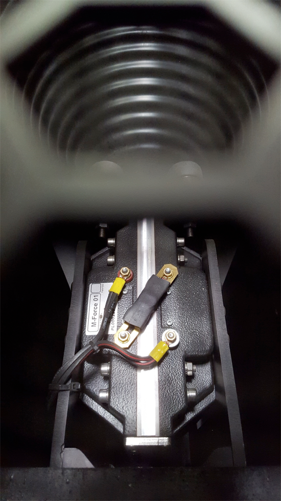 Powersoft M-Force 01 motor inside a subwoofer enclosure, below the cone