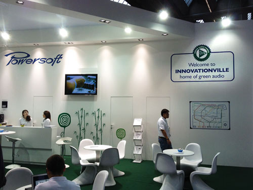 Powersoft booth at Prolight + Sound 2013 with the sign Welcome to Innovationville, home of green audio